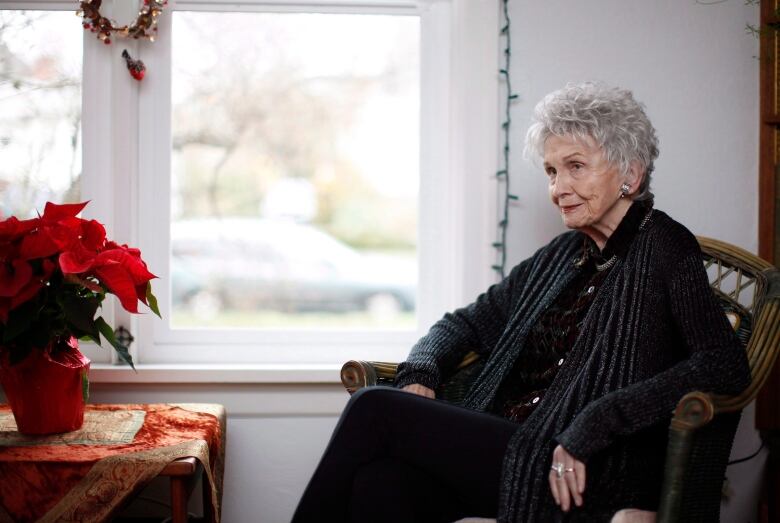 Photograph of an elderly woman sitting in an armchair 