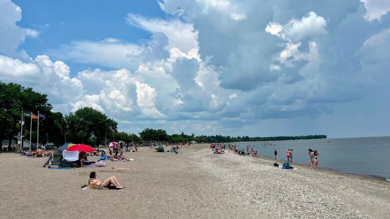 People lounge on a beach 