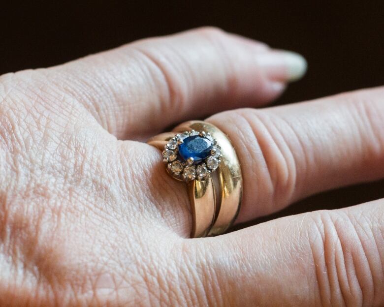 Scott's blue wedding ring, the same colour as her dress, on July 10, 2024 in London, Ont.