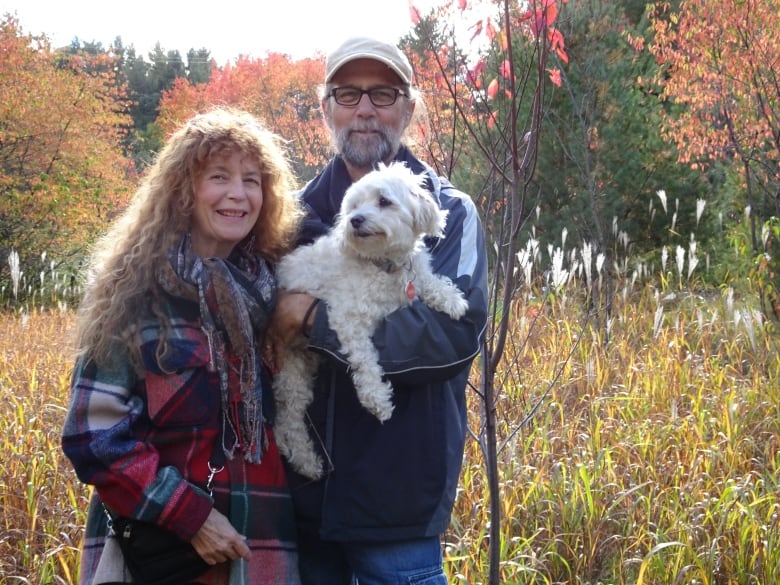 Ottawa couple MaryAnn Harris and Charles de Lint in a field.