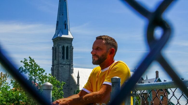 Chef Jordan Munn watched from behind a fence as the building he tried for several years to save was demolished