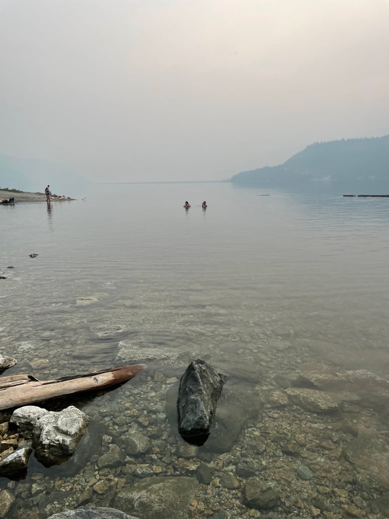 Smoke from Hiren Creek Wildfire above the dam at lake revelstoke