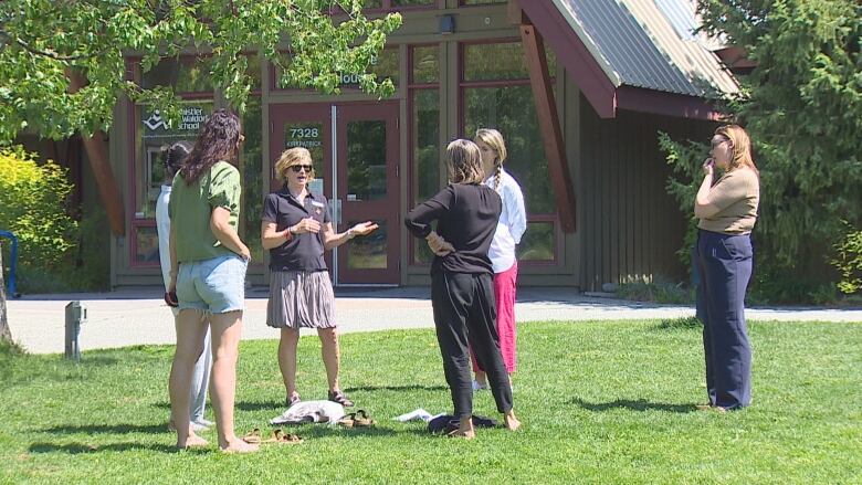 Acting Whistler mayor Cathy Jewett speaks with parents outside the Whistler Waldorf School.