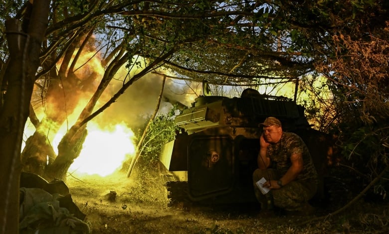 A Ukrainian soldier is seen next to a howitzer being fired toward Russian troops near the Ukrainian town of Chasiv Yar on Sunday, July 14, 2024.