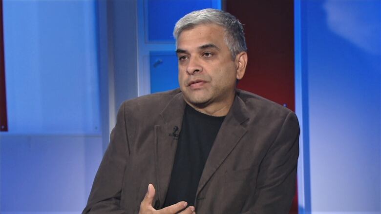 Dr. Trevor Jain in a television studio.