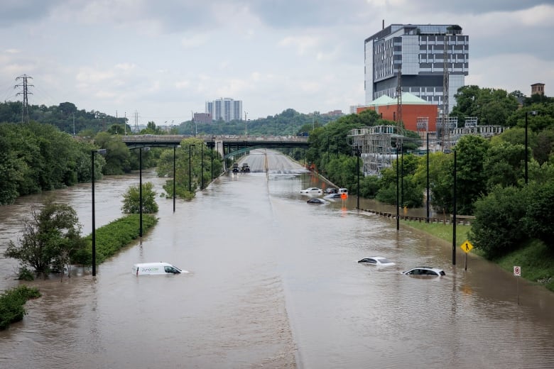 Cars on a flooded highway.