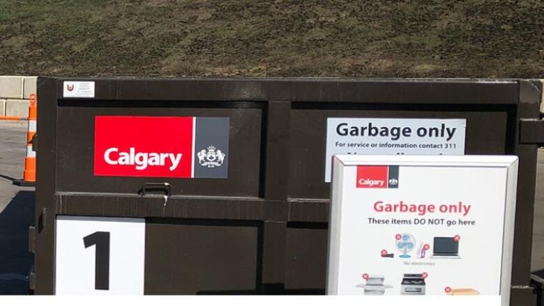 A brown eco centre bin features instructions that explain what items go where.