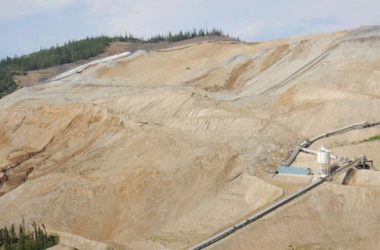 A southwest section of the collapsed heap leach facility and ore slide at Eagle mine.