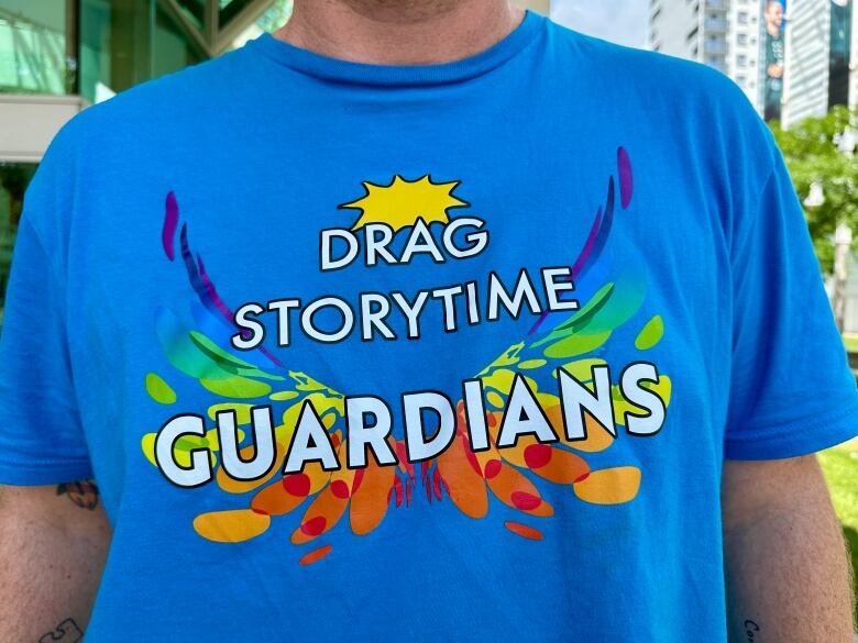 A t-shirt in support of drag storytime.