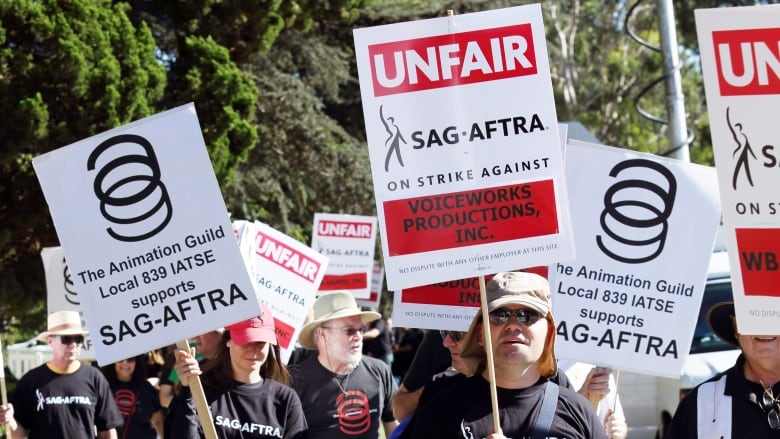 video game voice actors picket outside Warner Bros. Studios