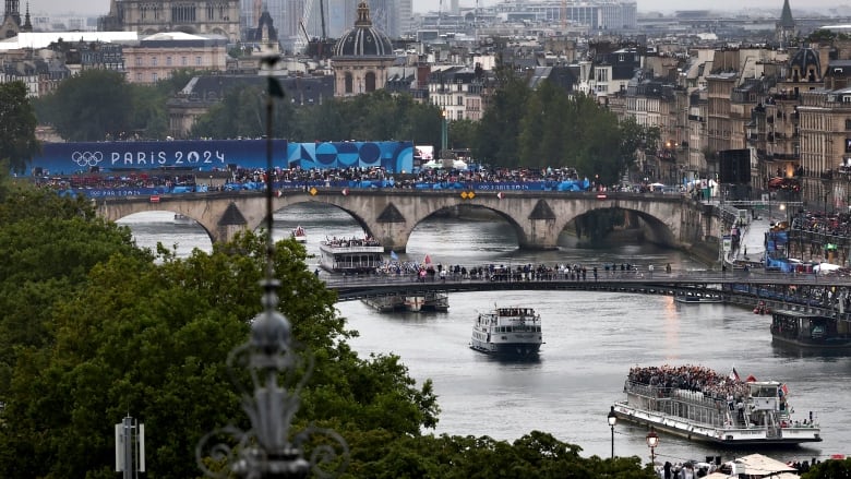 A bird's-eye view shows boats sailing down the Seine during the Paris 2024 opening ceremony.