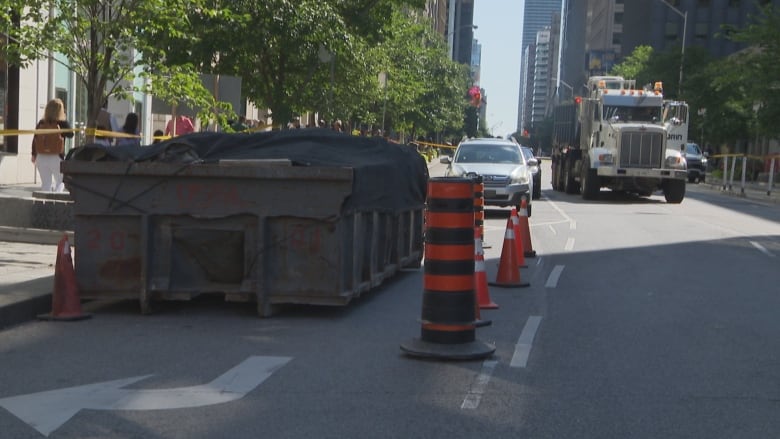 Construction bin blocking bike lane