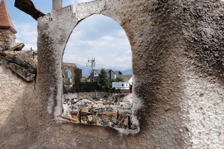 Church window with rubble behind it