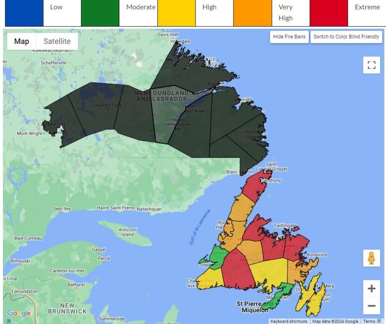 Map of island, some parts highlighted green, yellow, orange and red