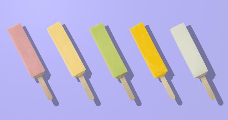 From left to right, five popsicles are shown in different colours against a purple backdrop: pink, yellow, green, orange and white.