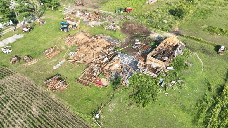 An image of a rural home that has been destroyed by a tornado, as seen from the sky by a drone.