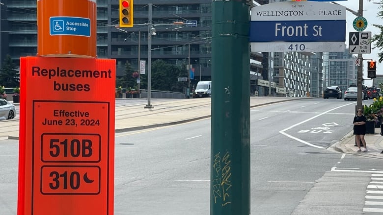 Orange TTC sign showing replacement buses numbers.