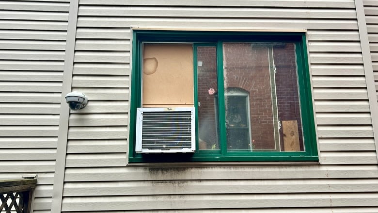 A window with an air conditioner unit