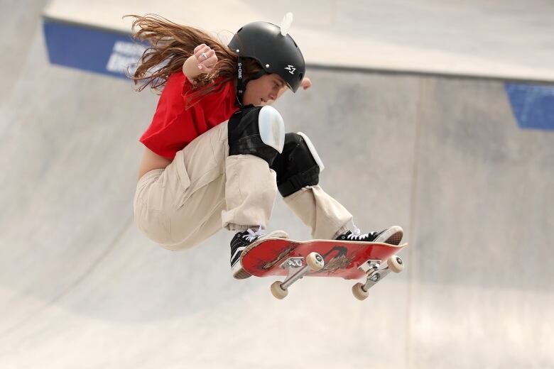 A skateboarder flies through the air.