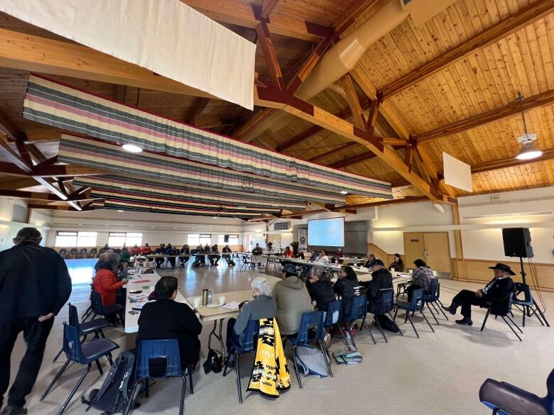 People sit around a conference table 