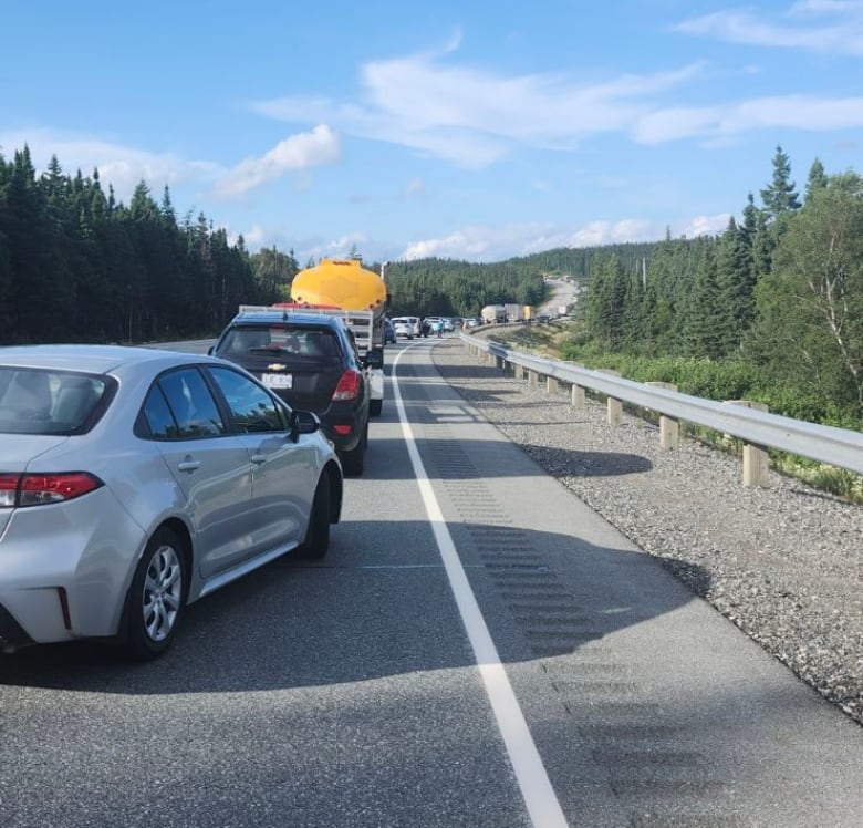 Cars in bumper to bumper traffic.