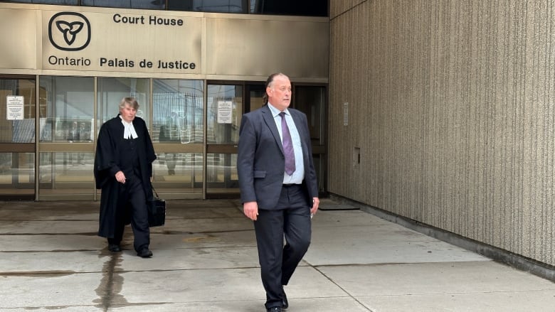 Trevor Birtch leaves the London courthouse alongside his lawyer on Aug. 8, 2024. The former Woodstock mayor was found guilty of one count of assault and another count of sexual assault for allegations stemming from 2021. 