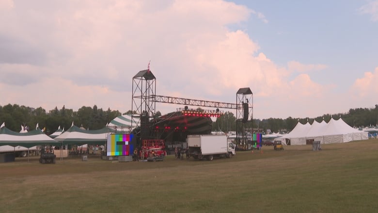 Stage and tents at a festival venue. 