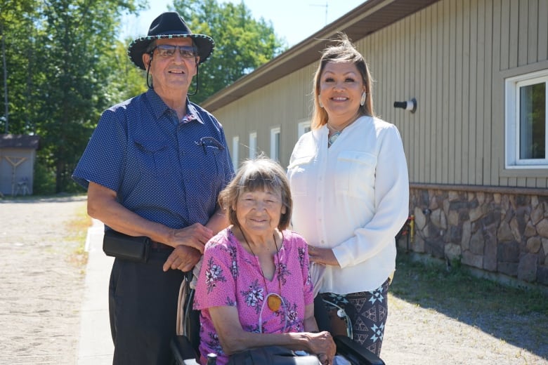 Three people posing for a portrait.