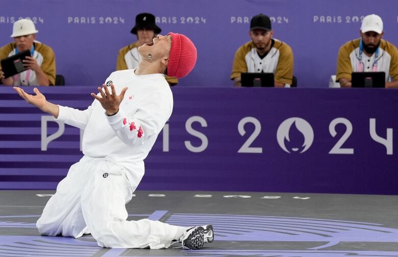 A male breaker is seen celebrating on the stage.