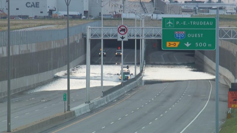 Vehicles using flooded Dorval Tunnel 