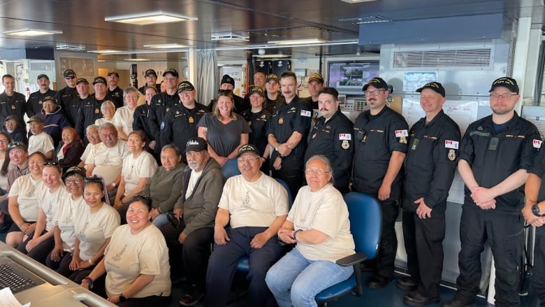 Group of Inuit elders and Royal Canadian Navy staff pose for group photo