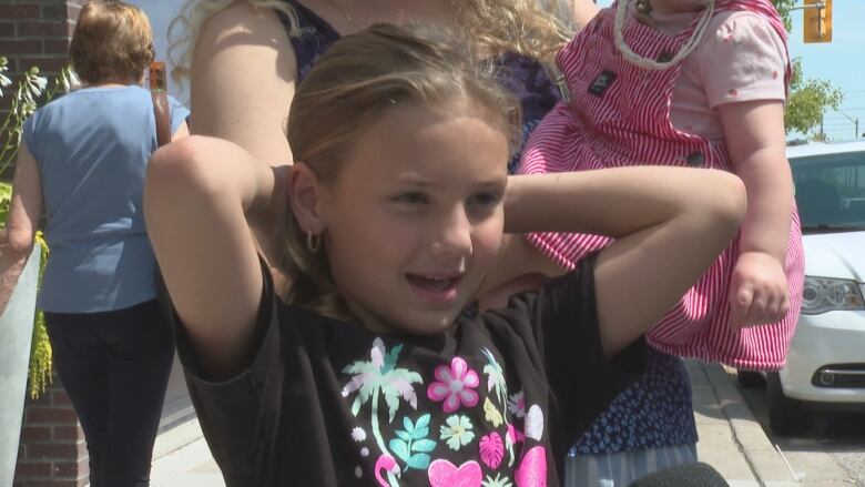 A young girl answering questions.