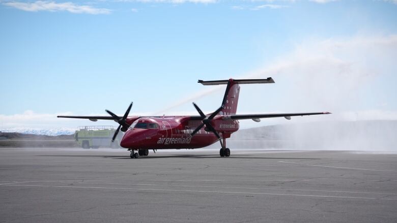 A plane that says Air Greenland on it. 