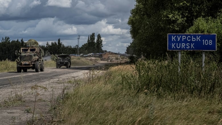 Two tanks travelling on road near Kursk region in Russia 