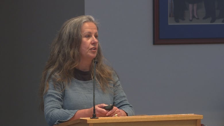 Dr. Sara Davidson speaks inside Fredericton council chambers.