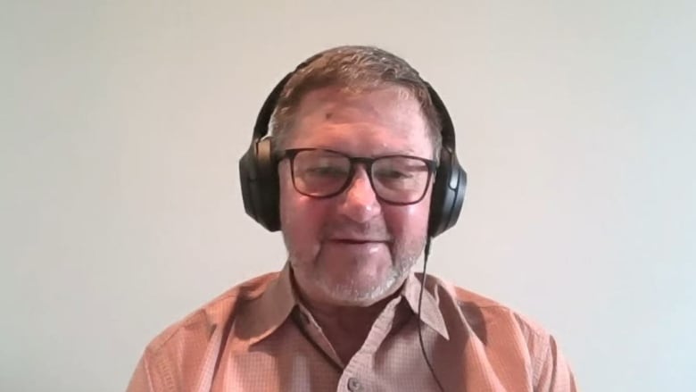 A man wearing headphones seen in a screenshot 