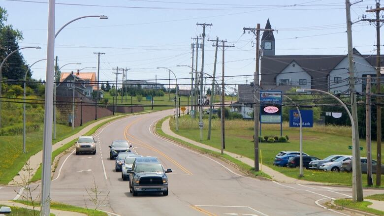 Cars pass through an intersection.