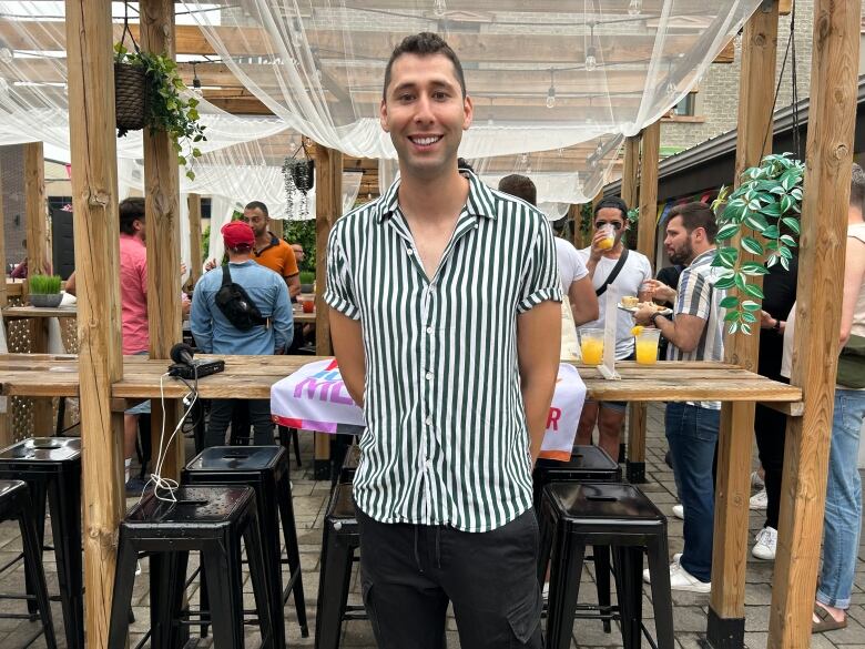 Adrian de Armero stands centre frame at the Canadian Foundation for Aids Research Pride brunch and dance