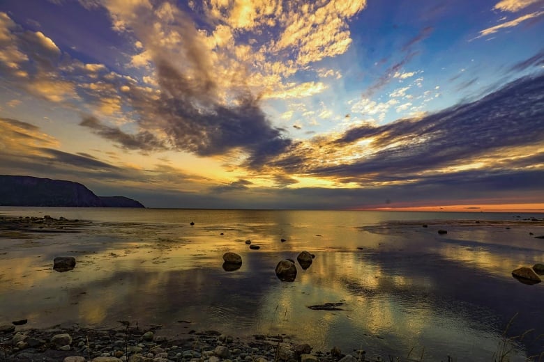 A cloudy sunset over the ocean.