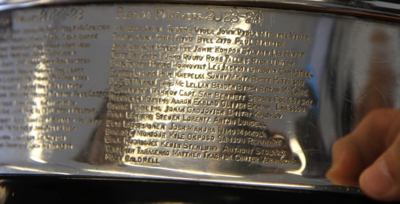 A shiny list of engraved names up close