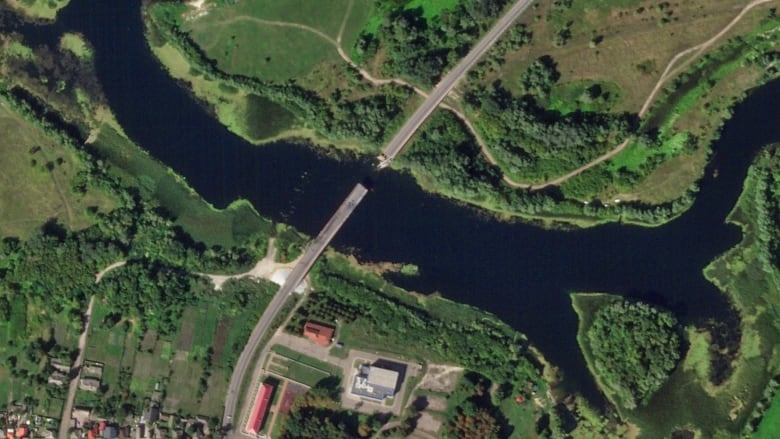 A satellite photo from Planet Labs PBC shows a destroyed bridge across the Seim River at the Russian town of Glushkovo, in the Kursk region, on Saturday.