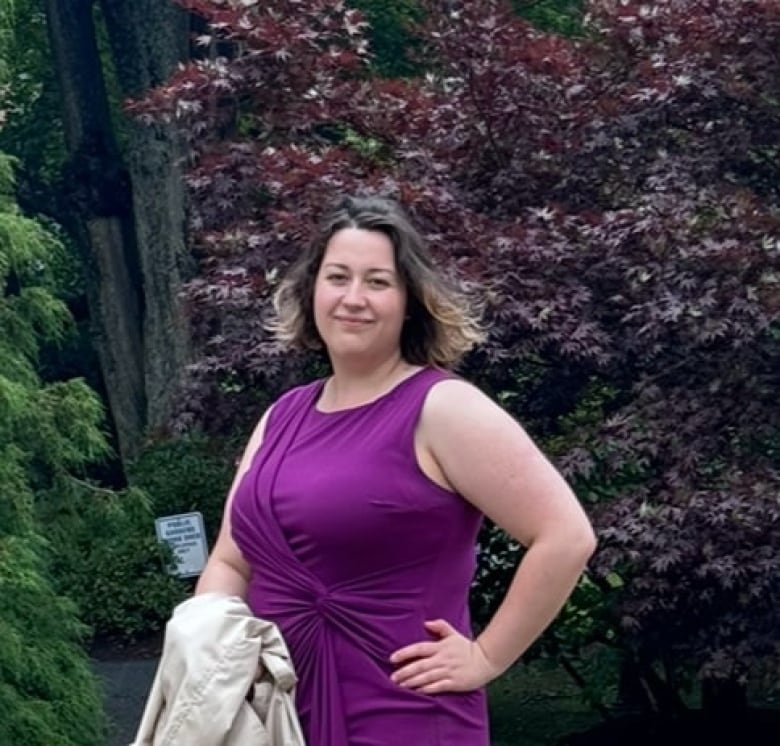 A woman in a purple dress.