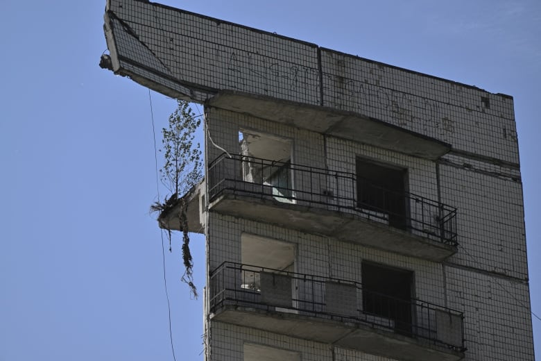 The remnants of a multi-storey building are seen in Myrnohrad, in Ukraine's Donetsk region, on Wednesday. The building was destroyed following a Russian strike days earlier.