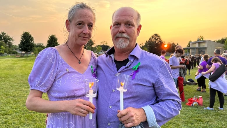 Brett and Jessica Broadfoot at a vigil on July 24, 2024 for their daughter Breanna, 17, who was fatally stabbed in a case police have linked to domestic violence. They are among families advocating for education on intimate partner violence and legislative change. 