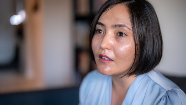 Close up of woman looking off camera.