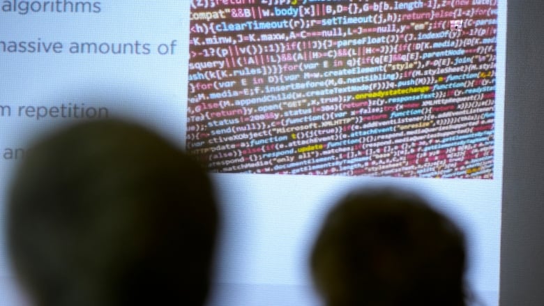 People listen to an artificial intelligence seminar at the Forsyth County Senior Center, Tuesday, June 25, 2024, in Cumming, Ga. 