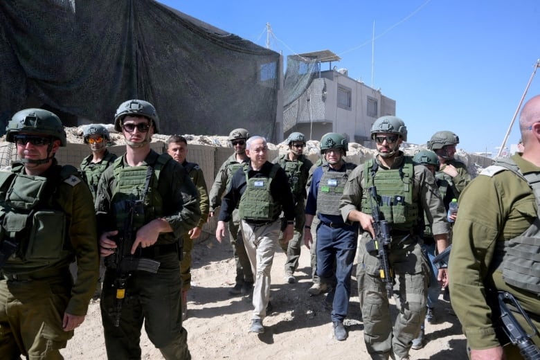 FILE PHOTO: Israeli Prime Minister Benjamin Netanyahu visits Israeli soldiers in Rafah, in the southern Gaza Strip, in this handout picture from July 18, 2024. 