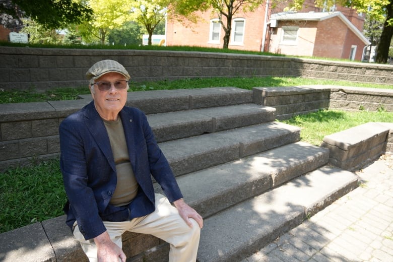 A man sitting on an outdoor staircase