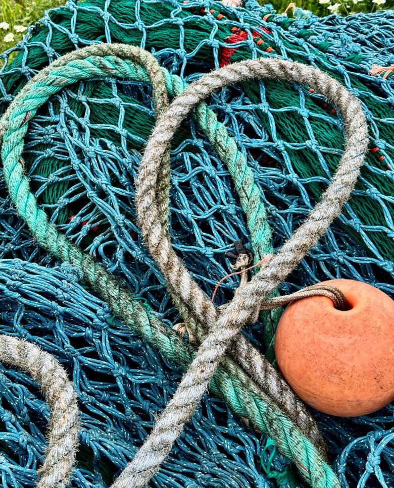 Fishing nets and rope, curled in a way that resembles a heart.