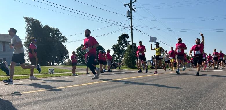 People running down the street.